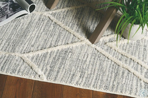 Image of 63" X 91" Ivory Grey Polyester Rug