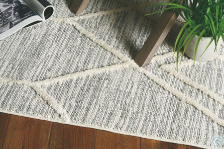 63" X 91" Ivory Grey Polyester Rug